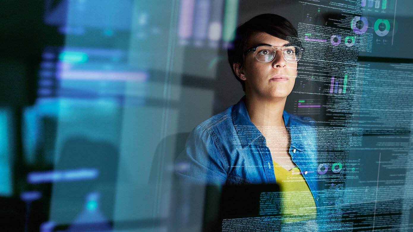 Image of woman looking at abstract data.